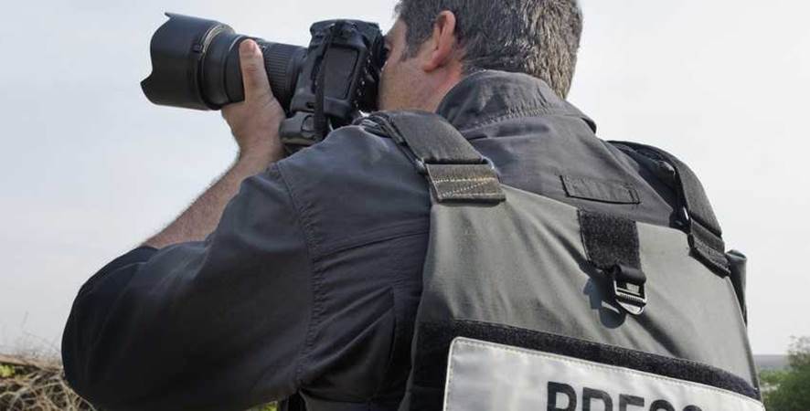 Reporter photographe